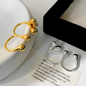Minimalist double finger open rings in gold and silver with fluid liquid design