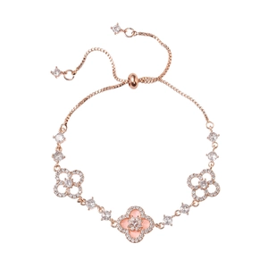 Rose gold clover bracelet with pink shell and zircon accents on a white background