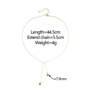 Gold chain necklace with minimalist round bead pendants and adjustable lobster clasp