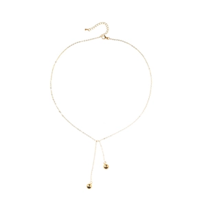 Minimalist gold chain necklace featuring two smooth metal spheres and adjustable clasp