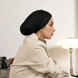 Detail view of the black breathable mercerized cotton hijab featuring elegant pleated design