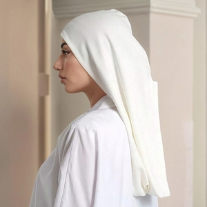 Close-up of pure white breathable mercerized cotton hijab with elegant side profile drape