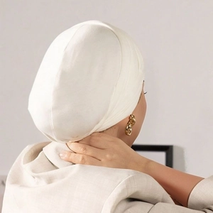 Close-up of white mercerized cotton hijab under-cap showing soft fabric texture