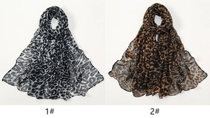 Detail view of leopard print chiffon scarves in black-grey and classic brown colorways