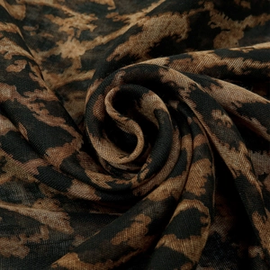 Macro detail of leopard print voile scarf showing soft texture and rose-shaped drape