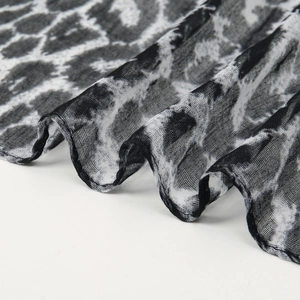 Detail view of lightweight leopard print voile scarf showing breathable mesh texture