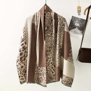 Close-up of leopard print patchwork scarf with fine tassel edge and thick texture