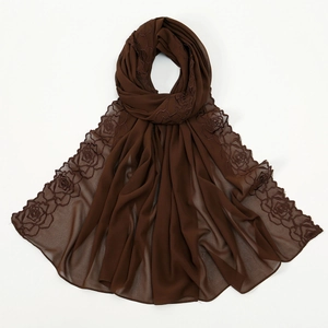 Close-up view of the elegant brown chiffon scarf featuring delicate rose embroidery details.