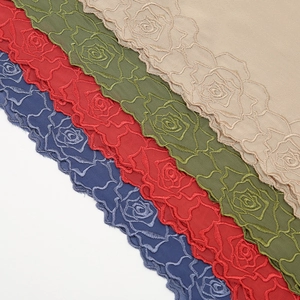 Detailed shot of fashionable embroidered chiffon long scarf, versatile hijab shawl for women.