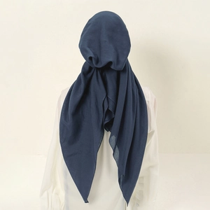 Rear view of long navy blue Muslim hijab with elegant fabric drape on model