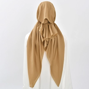 Detail view of khaki hijab featuring elegant draping fabric and layered pleats on back