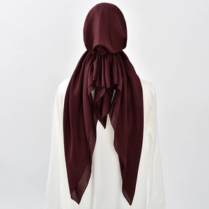Detail view of burgundy hijab showing fabric texture and long double tail drape from the back