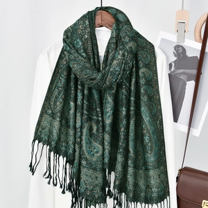 Dark green paisley jacquard shawl with gold thread patterns and black tassel fringe