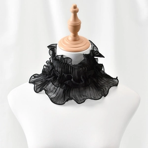 Close-up of elegant black ruffled pleated collar neck warmer for women's fashion decor