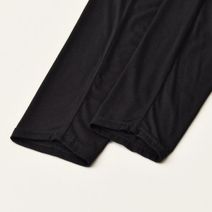 Close-up of black mercerized cotton sleeve with precision double-needle stitching detail