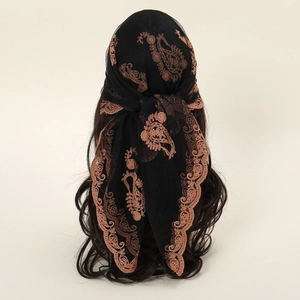 Elegant 80x80cm black lace square scarf with bronze paisley floral embroidery on a mannequin