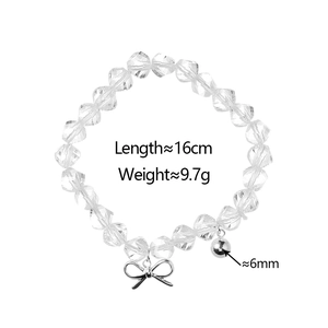 Detail of transparent crystal bead bracelet with silver bow and ball charm measurements
