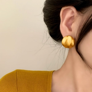 French style pleated golden sphere earrings with matte brushed metallic texture