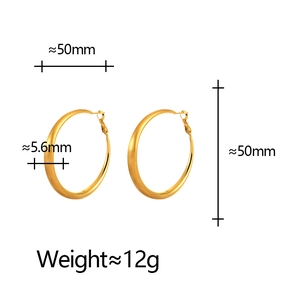 Exaggerated large 50mm gold hoop earrings with a brushed matte texture and 5.6mm width