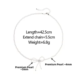 Detail of high-quality pearl bow necklace with crystal center and adjustable lobster clasp