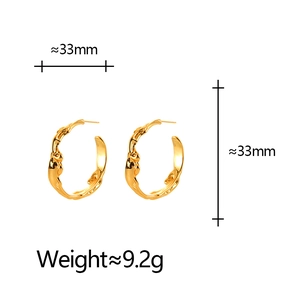 Minimalist irregular gold hoop earrings with organic texture and 33mm diameter