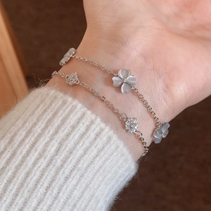 Double-layered silver bracelet with cat-eye stone flower and sparkling pavé accents