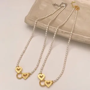 Minimalist freshwater pearl necklaces featuring unique heart clasp in gold and silver finish