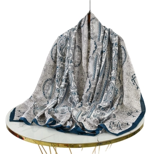 Elegant paisley print large scarf in off-white and navy blue with smooth texture