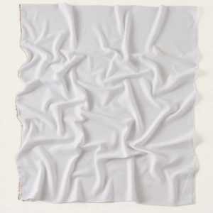 Close-up of white chiffon scarf with elegant gold chain link edge detail and soft texture