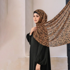Muslim women's black abaya with a leopard print hijab featuring subtle metallic glitter accents