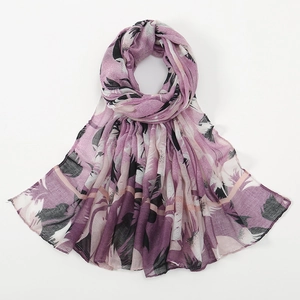 Close-up of lightweight floral voile scarf with artistic feather print and fine stitching