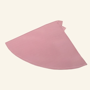 Detail of light pink Muslim prayer skirt showing wide semi-circle cut and smooth fabric