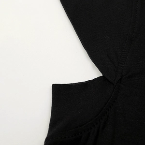 Black mercerized cotton headscarf cap with detailed flat-seam edge and knit texture