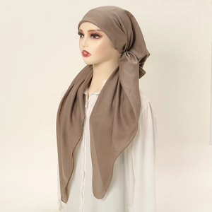 Detail view of ethnic style dark brown elastic headscarf with two trailing tails