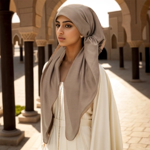 Detail of elegant ethnic headscarf and abaya with gold chain belt decoration