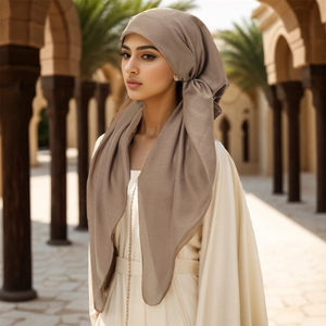 Close-up of taupe ethnic turban cap with premium textured fabric and elegant draping