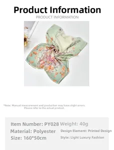 Detail of light green floral georgette scarf showing 160x50cm size and polyester fabric