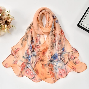 Detail of Georgette scarf with elegant ink plum blossom print on soft apricot fabric