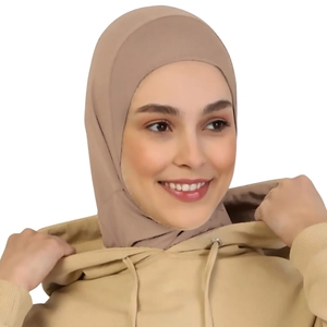 Detail of beige breathable hijab inner cap showing elastic fit on model's head