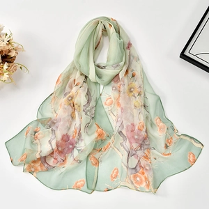 Detailed view of light green floral georgette scarf with vibrant blossom patterns