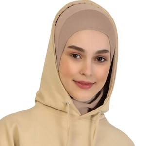 Detail of beige hooded hijab top with soft knit texture and adjustable drawstrings