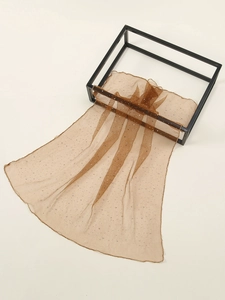 Detail of light brown mesh headscarf with shimmering rhinestones and fine edge stitching