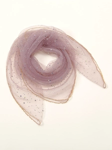 Macro shot of light purple tulle scarf featuring sparkling sequins and gold beaded edge