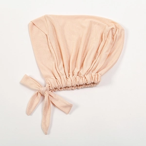 Elastic modal cotton chemo turban hat with side bow tie in soft peach color