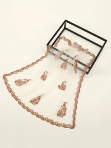 Detailed embroidery of brown paisley patterns on premium white mesh lace fabric