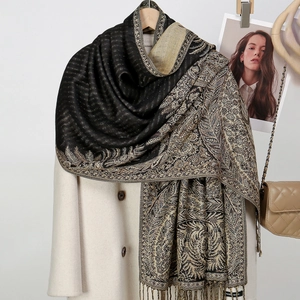 Detail view of double-sided jacquard floral scarf with fringes and Hand Made label