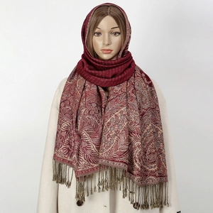 Detailed paisley pattern and tassels on burgundy ethnic polyester shawl for women