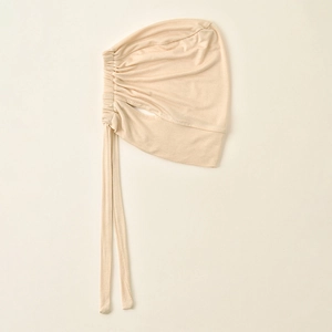 Detail of beige modal hijab inner cap showing elastic drawstring and ribbed texture