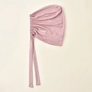 Pink modal hijab undercap featuring detailed side pleats and adjustable back ties