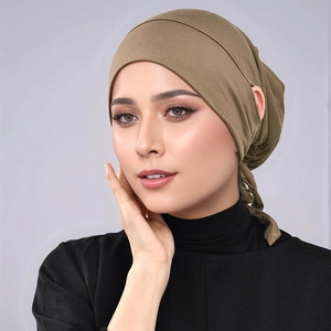 Detailed texture of olive green modal undercap with adjustable ties for secure fit